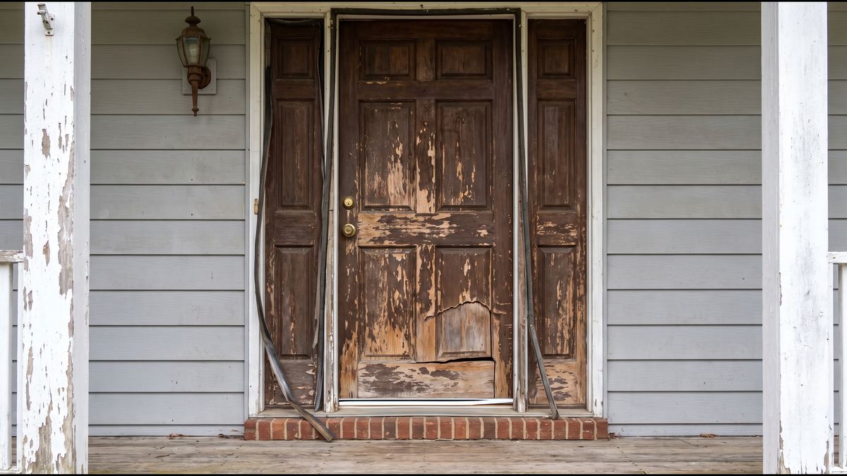 Door weatherproofing repair: before