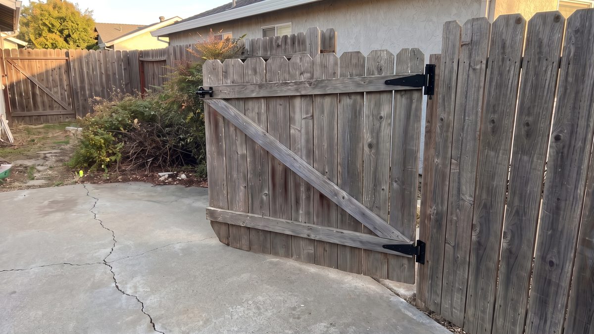 The same gate re-hung square with new hinges and latch