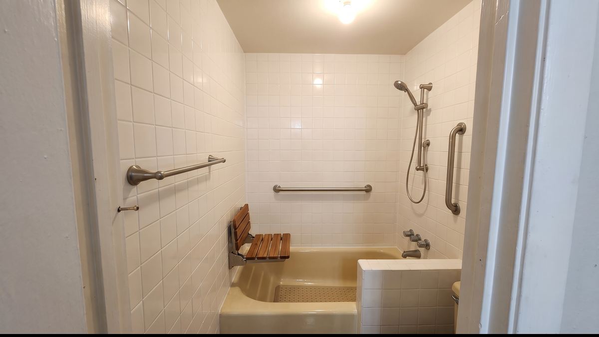 Bathroom safety repair: after, same material repaired