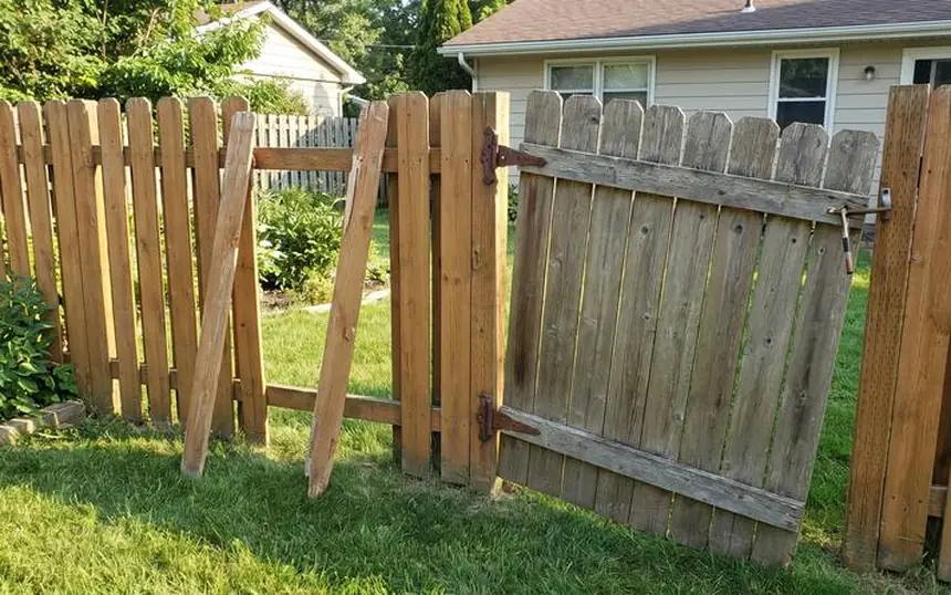 Before: San Diego wood fence with broken pickets and a sagging gate