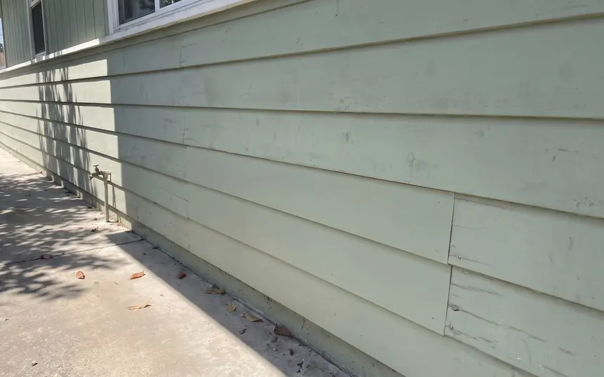 After: the rotted section replaced and painted to match
