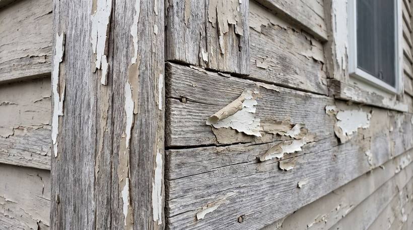 Weathered peeling exterior wood trim before restoration in Orange County