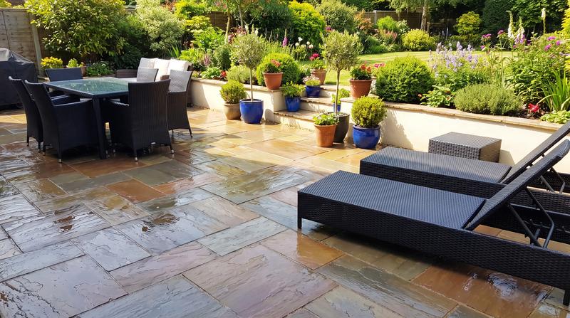 A stone patio bright and clean after pressure washing