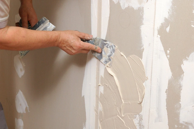 Drywall being textured