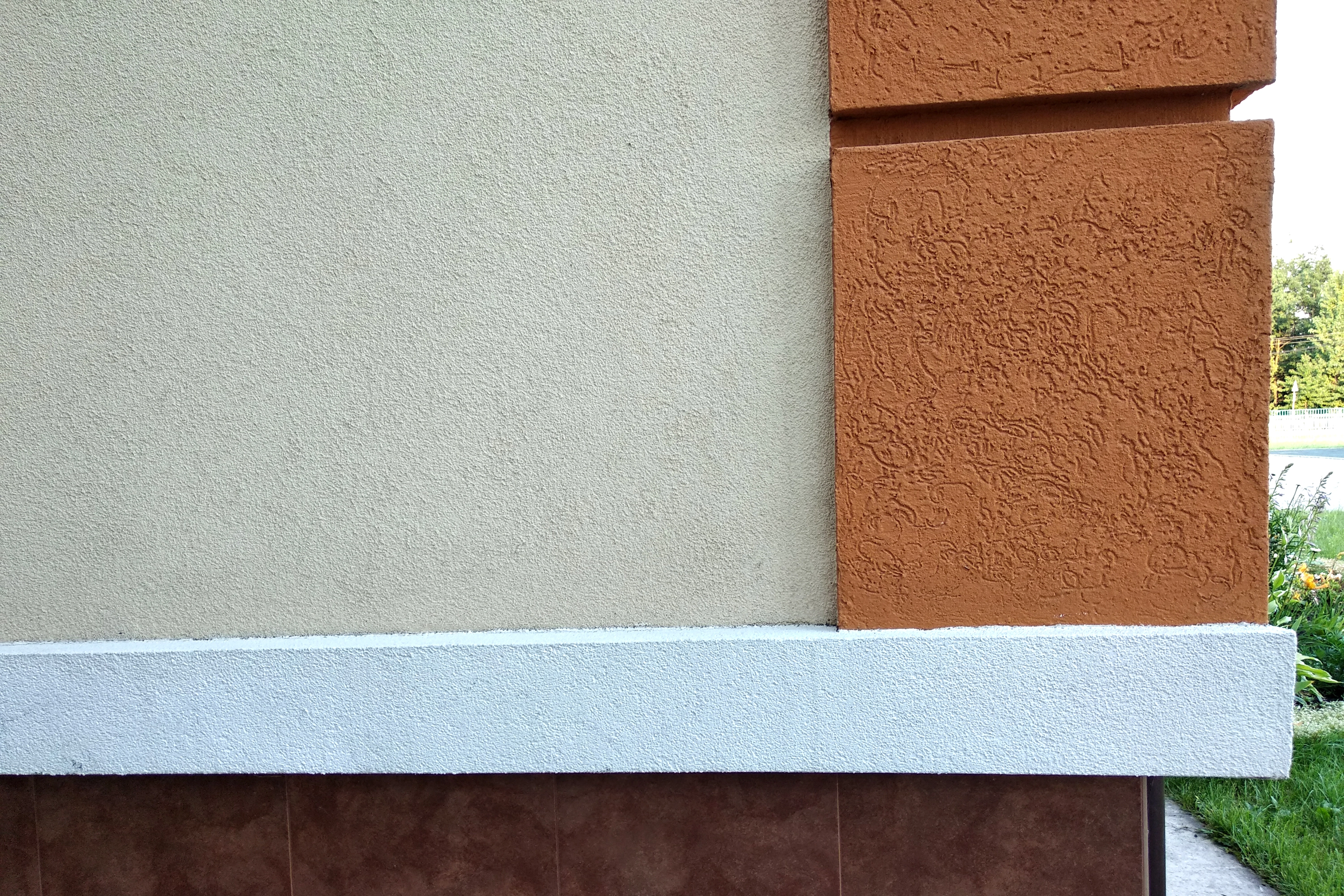 Close-up detail of a building's stucco exterior facade