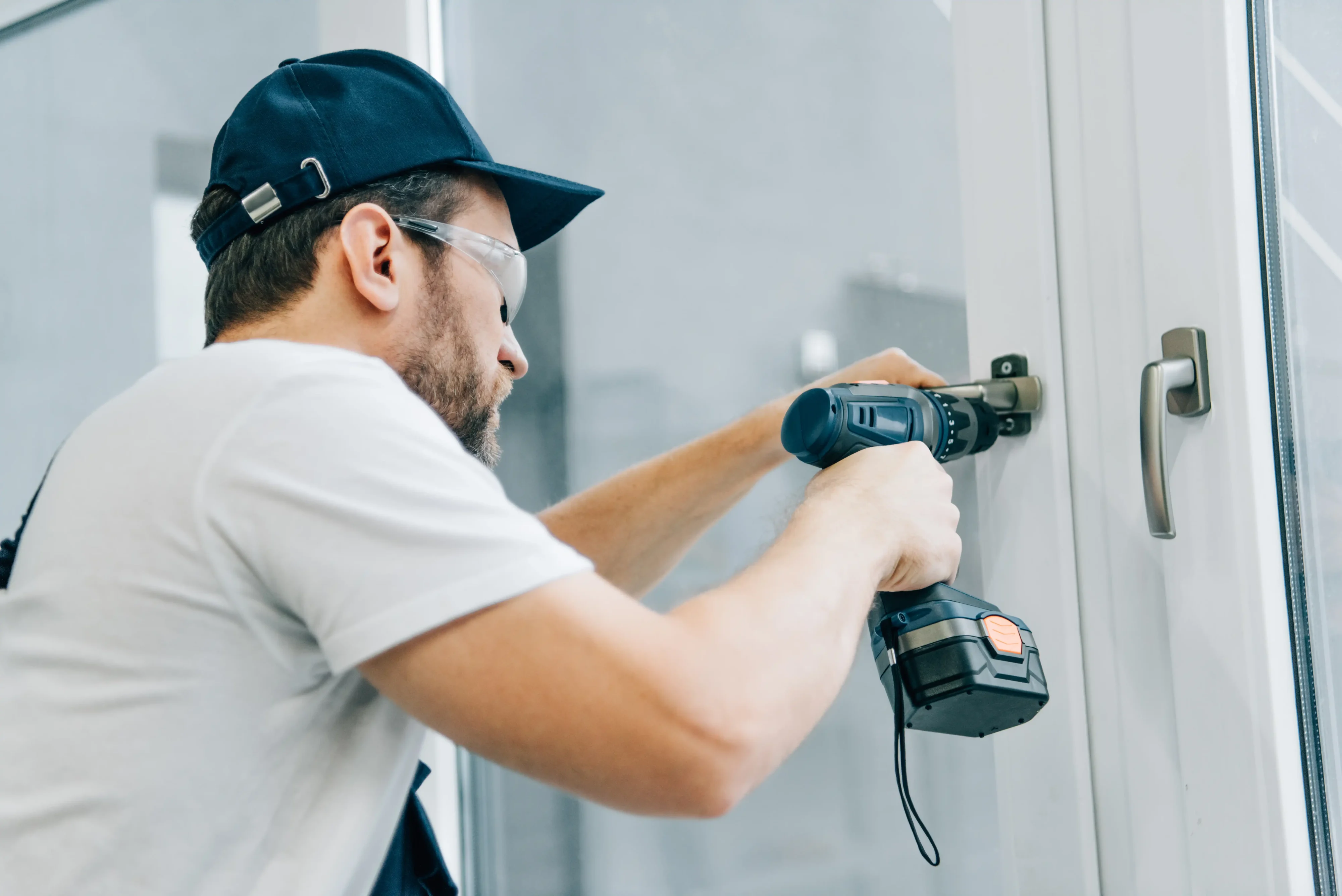 Technician finishing drywall repair on an interior wall